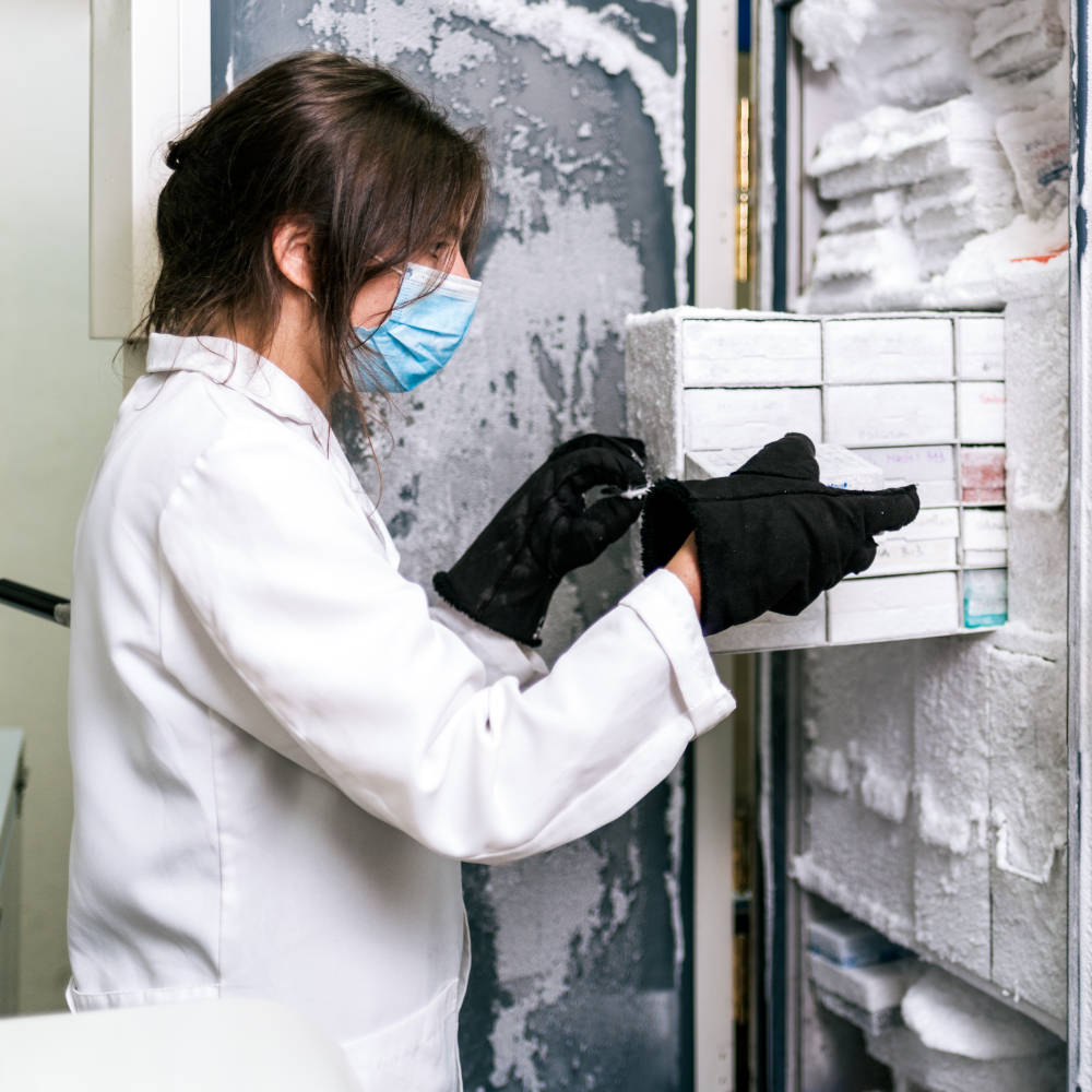 Female Scientist saving vaccines cooled by medical nitrogen in Laboratory