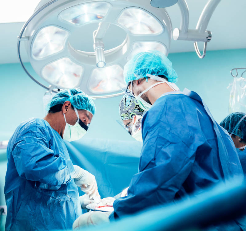 Team of Surgeons Operating.